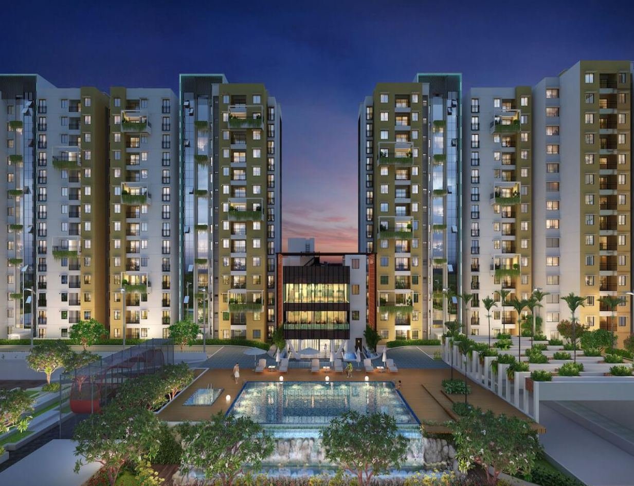 Residential apartment towers with landscaped pool deck at dusk