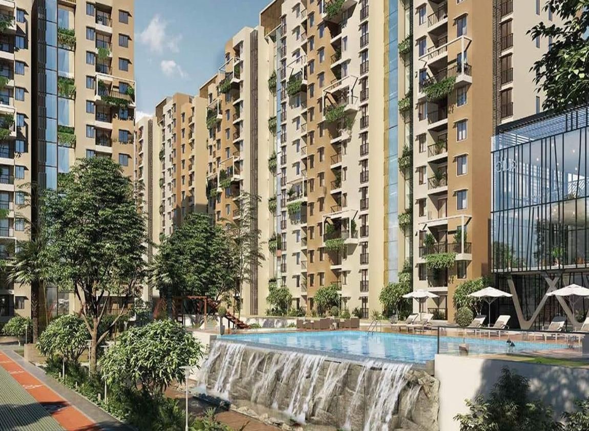 Apartment complex with cascading water feature and pool deck