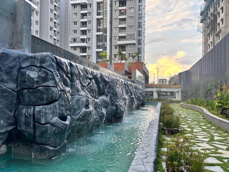 Purva Zenium rock-face water feature and landscaped walkway
